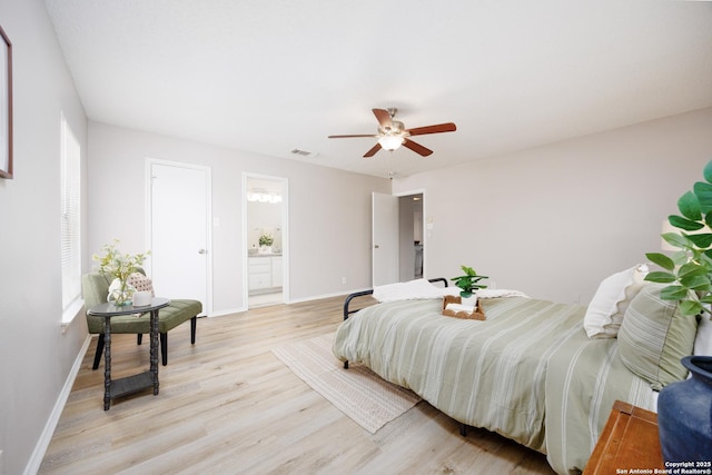 10511 Stone Crk, San Antonio, TX 78254 - bedroom featuring light wood finished floors, baseboards, ceiling fan, and connected bathroom