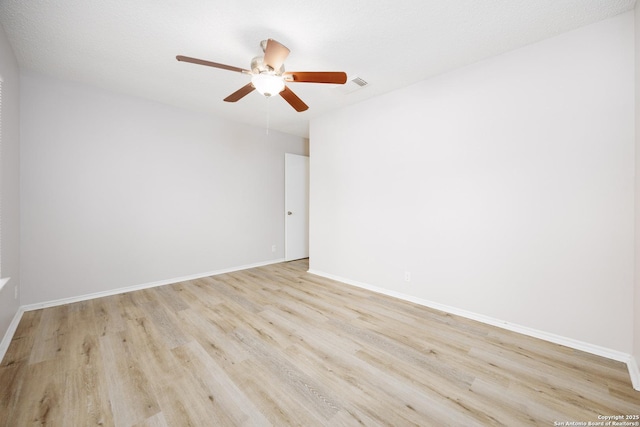 10511 Stone Crk, San Antonio, TX 78254 - empty room with wood finished floors, ceiling fan, and baseboards