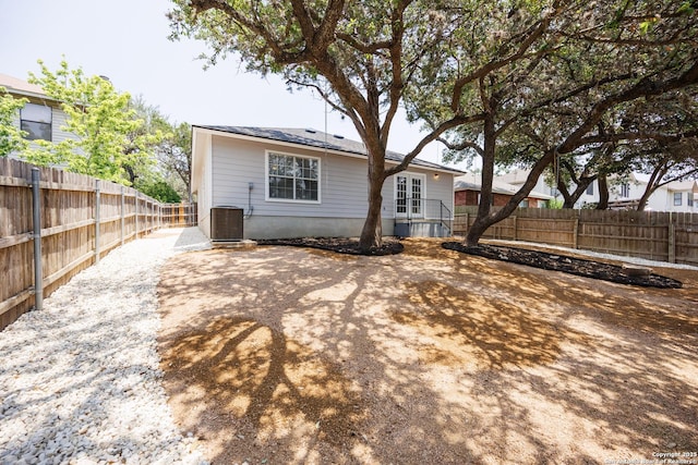 10511 Stone Crk, San Antonio, TX 78254 - back of house featuring a fenced backyard, central AC unit, and a patio area