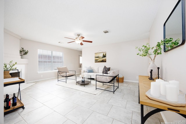 10511 Stone Crk, San Antonio, TX 78254 - living area with a ceiling fan, light tile patterned floors, and baseboards