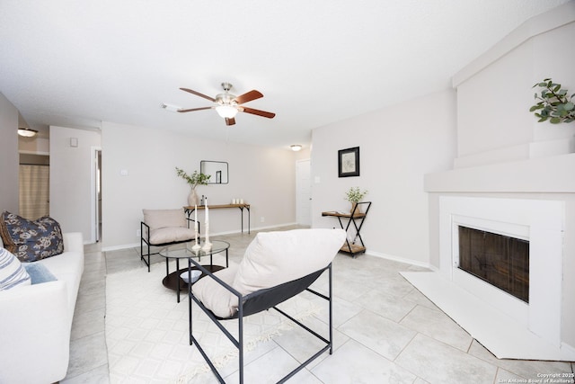 10511 Stone Crk, San Antonio, TX 78254 - living area featuring a ceiling fan, a fireplace with flush hearth, and light tile patterned floors