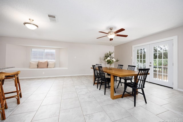 10511 Stone Crk, San Antonio, TX 78254 - dining space with plenty of natural light, french doors, a ceiling fan, and light tile patterned floors