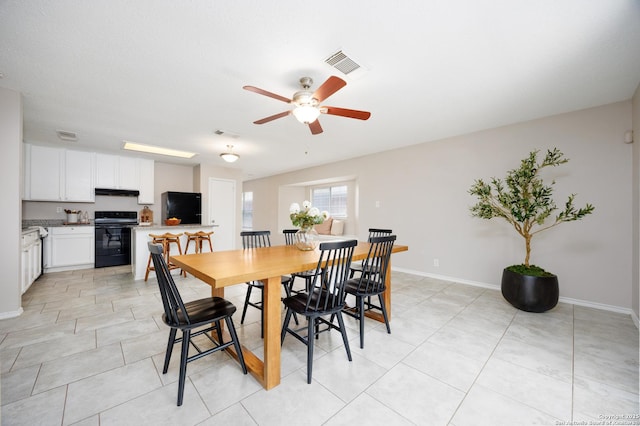 10511 Stone Crk, San Antonio, TX 78254 - dining room with a ceiling fan, baseboards, and light tile patterned flooring