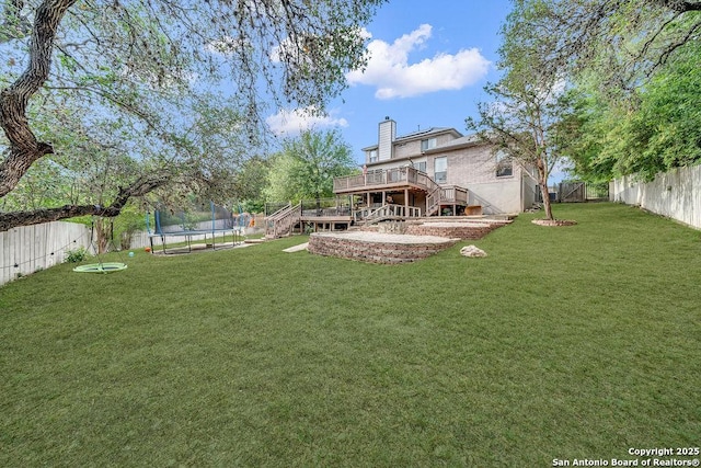13619 Mesa Pt, San Antonio, TX 78232 - view of yard with a trampoline, stairs, and a deck