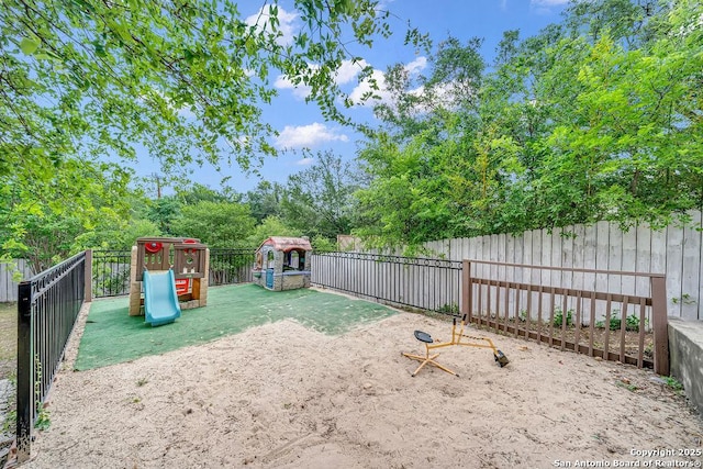 13619 Mesa Pt, San Antonio, TX 78232 - fenced backyard featuring a playground