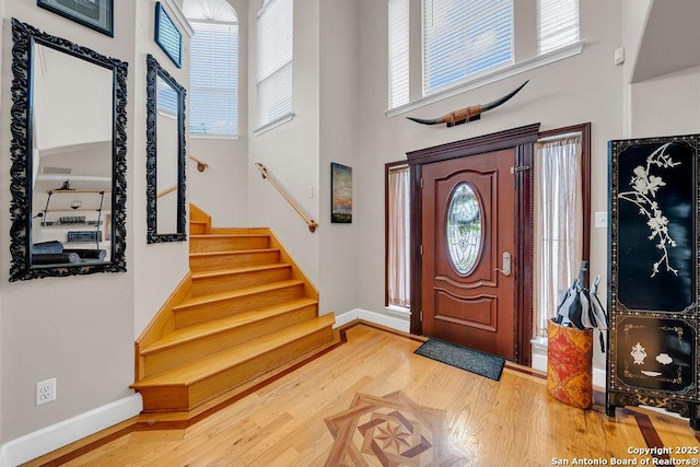 13619 Mesa Pt, San Antonio, TX 78232 - entrance foyer with a towering ceiling, wood finished floors, stairs, and baseboards