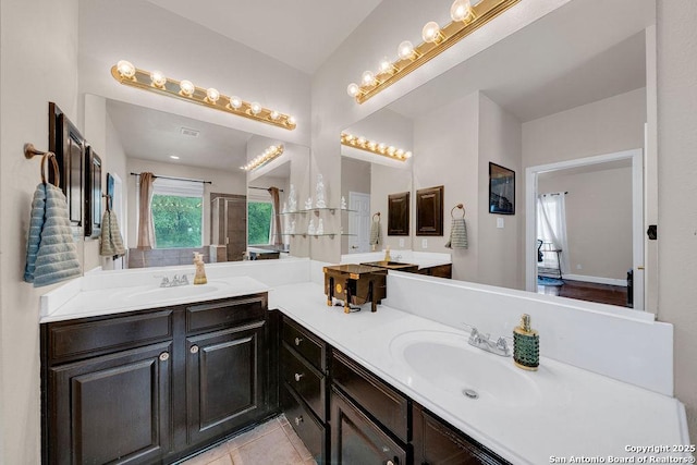 13619 Mesa Pt, San Antonio, TX 78232 - full bath featuring double vanity, a shower with door, and tile patterned floors
