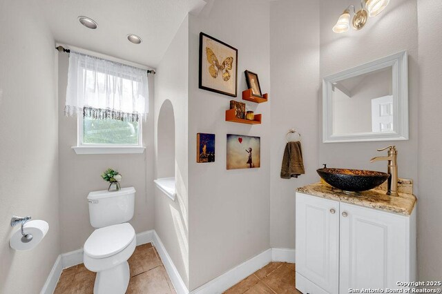 13619 Mesa Pt, San Antonio, TX 78232 - bathroom featuring toilet, tile patterned flooring, vanity, and baseboards