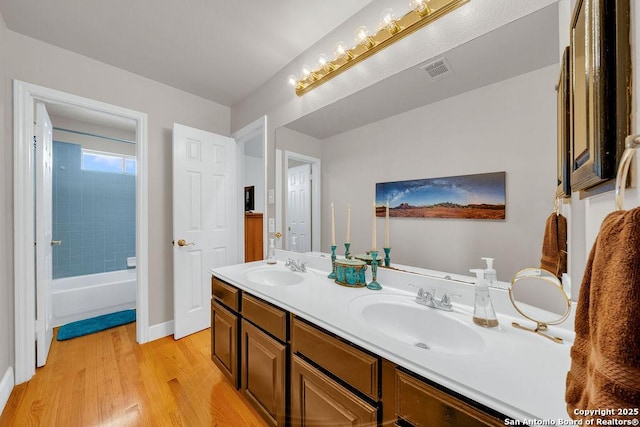 13619 Mesa Pt, San Antonio, TX 78232 - full bathroom with wood finished floors, double vanity, and baseboards