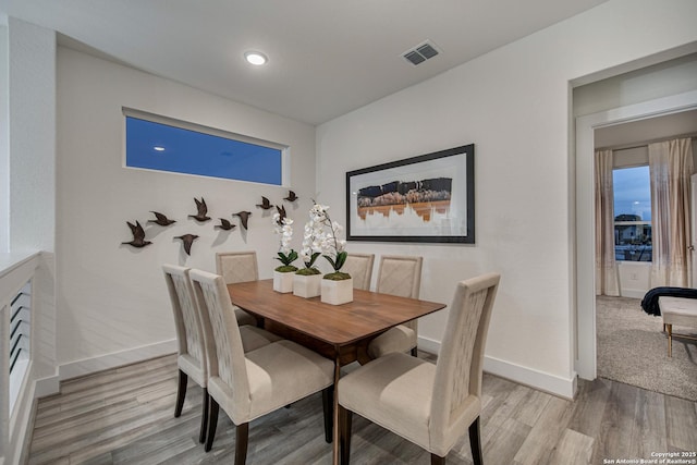 20675 Huebner Rd, San Antonio, TX 78258 - dining space featuring light wood-style floors and baseboards