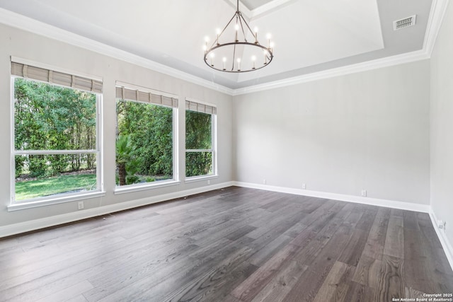 6327 Almeria Cir, San Antonio, TX 78257 - spare room with a chandelier, dark wood-type flooring, baseboards, ornamental molding, and a tray ceiling