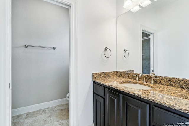 6327 Almeria Cir, San Antonio, TX 78257 - bathroom featuring vanity, toilet, and baseboards