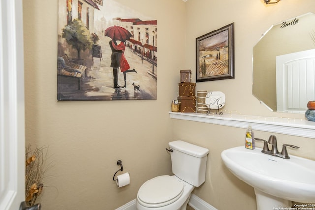 3308 Ashleys, Marion, TX 78124 - bathroom with a sink, toilet, and baseboards