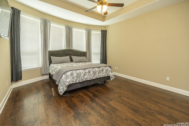 3308 Ashleys, Marion, TX 78124 - bedroom with baseboards, wood finished floors, a raised ceiling, and a ceiling fan