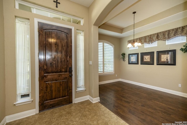 3308 Ashleys, Marion, TX 78124 - tiled entryway with a chandelier, arched walkways, and baseboards