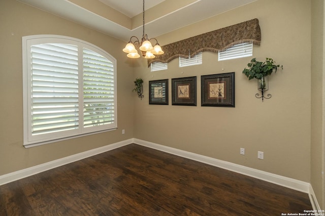 3308 Ashleys, Marion, TX 78124 - unfurnished room with a chandelier, dark wood-type flooring, and baseboards