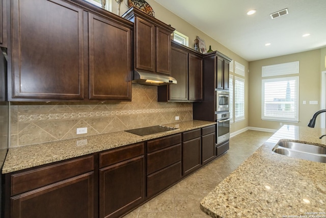 3308 Ashleys, Marion, TX 78124 - kitchen featuring a sink, appliances with stainless steel finishes, under cabinet range hood, decorative backsplash, and recessed lighting