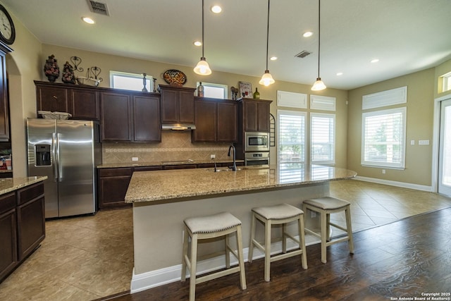3308 Ashleys, Marion, TX 78124 - kitchen with appliances with stainless steel finishes, backsplash, healthy amount of natural light, recessed lighting, and dark brown cabinets