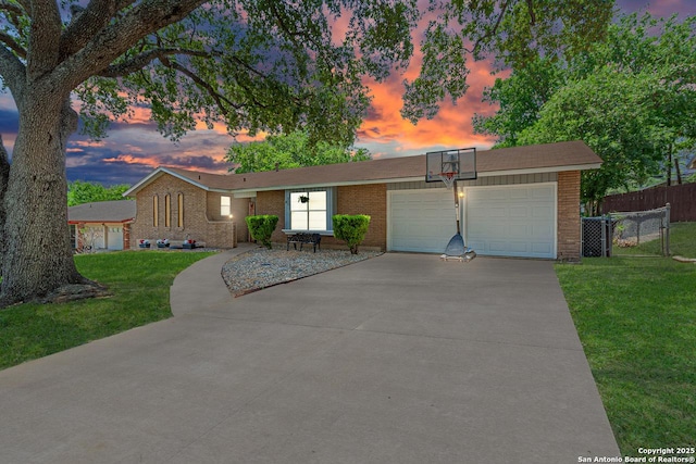 5718 Ponderosa Dr, San Antonio, TX 78240 - ranch-style house with brick siding, concrete driveway, and an attached garage