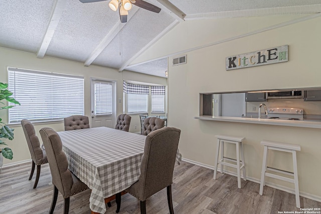 5718 Ponderosa Dr, San Antonio, TX 78240 - dining area with wood finished floors, baseboards, ceiling fan, and a textured ceiling