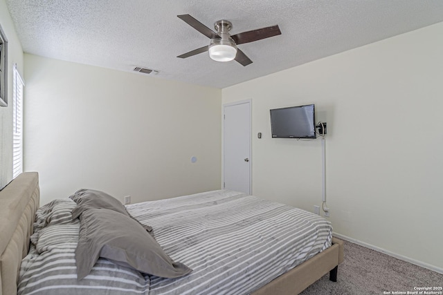 5718 Ponderosa Dr, San Antonio, TX 78240 - bedroom featuring carpet floors, a textured ceiling, a ceiling fan, and baseboards