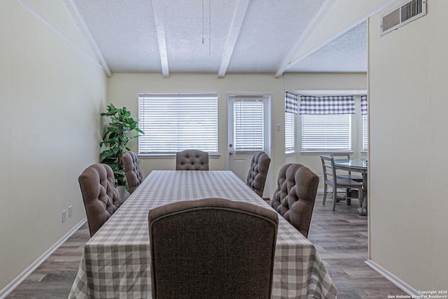 5718 Ponderosa Dr, San Antonio, TX 78240 - dining space with plenty of natural light, wood finished floors, beam ceiling, a textured ceiling, and baseboards