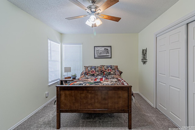 5718 Ponderosa Dr, San Antonio, TX 78240 - carpeted bedroom featuring a textured ceiling, baseboards, and ceiling fan