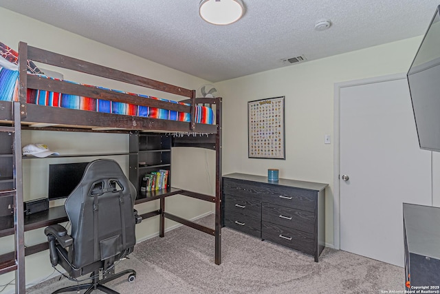 5718 Ponderosa Dr, San Antonio, TX 78240 - carpeted bedroom featuring a textured ceiling and a desk