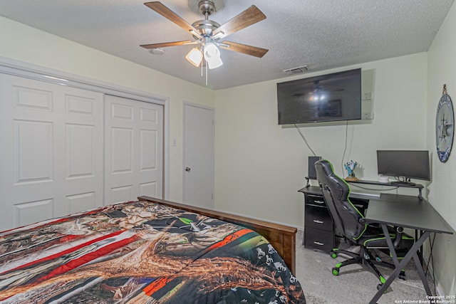 5718 Ponderosa Dr, San Antonio, TX 78240 - carpeted bedroom featuring a textured ceiling, an office area, a closet, a ceiling fan, and baseboards