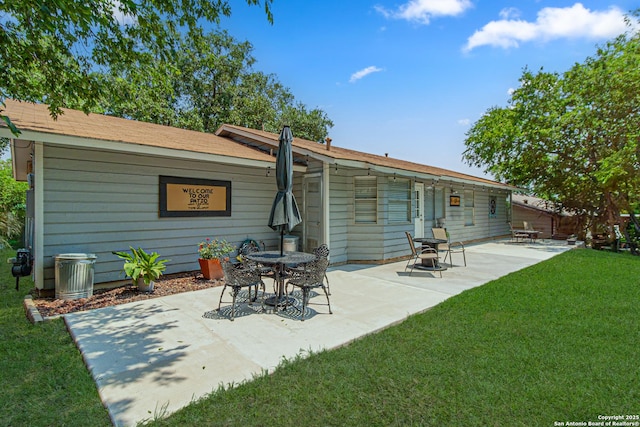 5718 Ponderosa Dr, San Antonio, TX 78240 - rear view of property with a yard and a patio