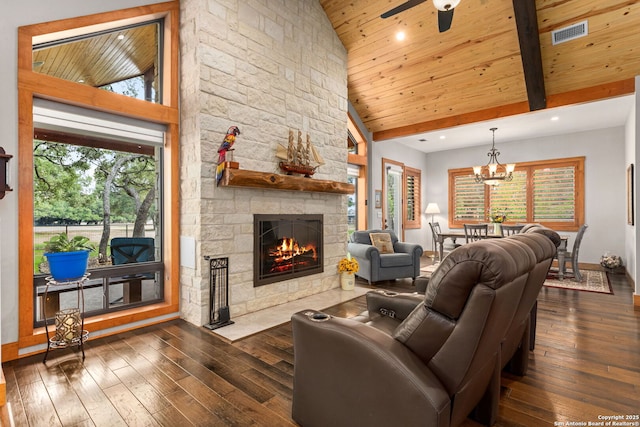 1133 Horseshoe Fls, Bandera, TX 78003 - living area with dark wood-style flooring, a stone fireplace, wood ceiling, recessed lighting, and ceiling fan