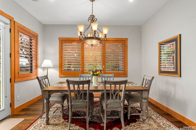 1133 Horseshoe Fls, Bandera, TX 78003 - dining room featuring a chandelier, wood finished floors, and baseboards