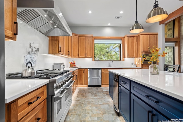 1133 Horseshoe Fls, Bandera, TX 78003 - kitchen featuring appliances with stainless steel finishes, exhaust hood, stone finish flooring, light countertops, and recessed lighting