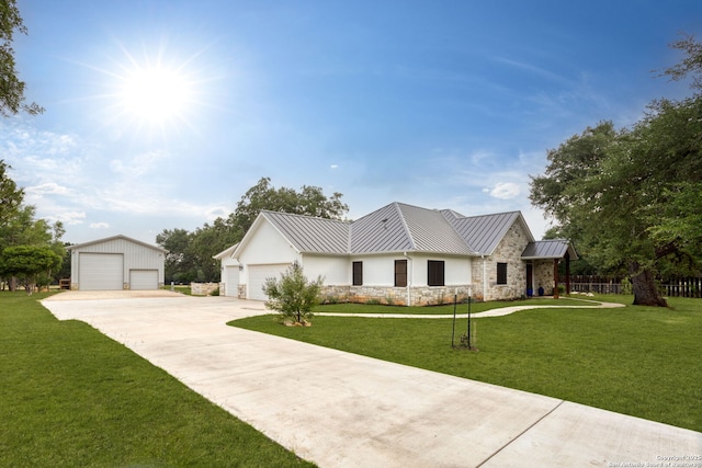 1133 Horseshoe Fls, Bandera, TX 78003 - view of front of property with a standing seam roof, a front yard, a detached garage, and metal roof