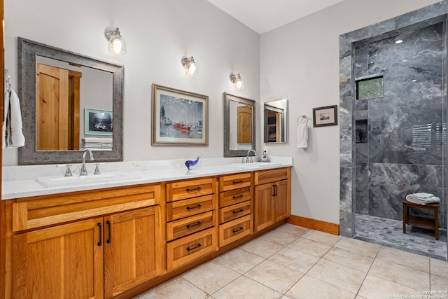 1133 Horseshoe Fls, Bandera, TX 78003 - bathroom featuring walk in shower, double vanity, tile patterned floors, and baseboards