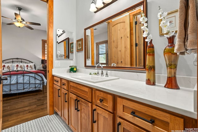 1133 Horseshoe Fls, Bandera, TX 78003 - bathroom featuring vanity, ceiling fan, and wood finished floors