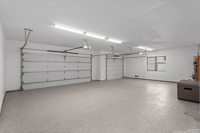 1133 Horseshoe Fls, Bandera, TX 78003 - garage featuring a garage door opener and water heater