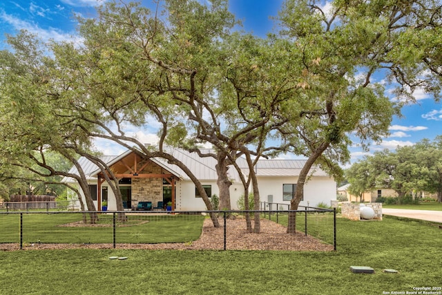 1133 Horseshoe Fls, Bandera, TX 78003 - view of front of house featuring stone siding, a standing seam roof, metal roof, and stucco siding