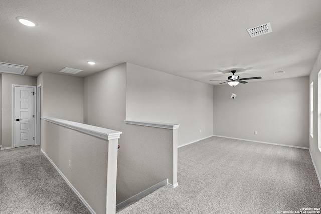 6610 Lowrie Block, San Antonio, TX 78239 - carpeted spare room featuring attic access, baseboards, a ceiling fan, and recessed lighting