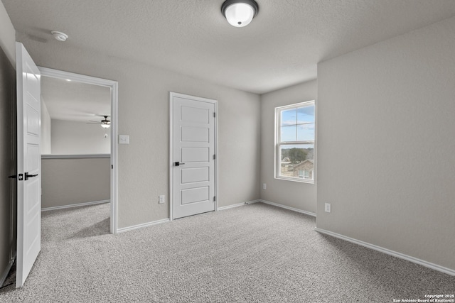 6610 Lowrie Block, San Antonio, TX 78239 - unfurnished bedroom featuring carpet floors, a textured ceiling, and baseboards