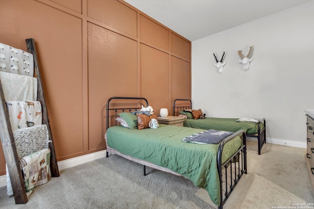 2977 Grove, Seguin, TX 78155 - bedroom with a decorative wall, light carpet, and baseboards