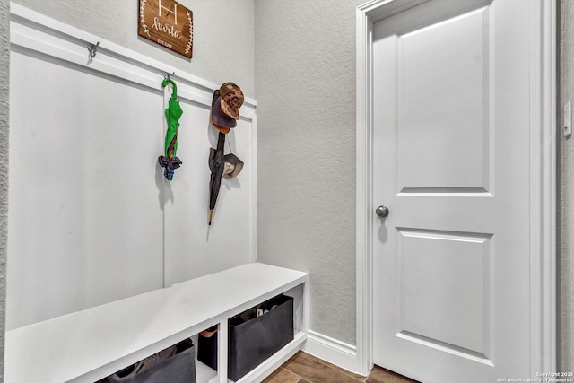 2977 Grove, Seguin, TX 78155 - mudroom featuring a textured wall, wood finished floors, and baseboards