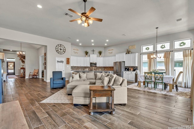 2977 Grove, Seguin, TX 78155 - living area featuring a chandelier, ceiling fan, recessed lighting, dark wood-style flooring, and baseboards