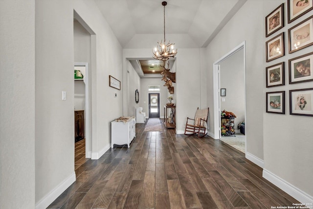 2977 Grove, Seguin, TX 78155 - hallway featuring a chandelier, dark wood-style flooring, lofted ceiling, and baseboards
