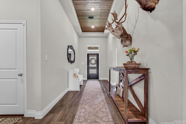 2977 Grove, Seguin, TX 78155 - foyer with baseboards, dark wood-style floors, wooden ceiling, a tray ceiling, and recessed lighting