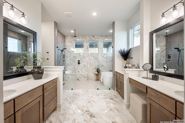 411 Poe Pkwy, Castroville, TX 78009 - bathroom with walk in shower, a soaking tub, plenty of natural light, and marble tiled floors