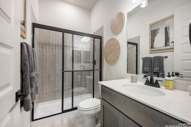 411 Poe Pkwy, Castroville, TX 78009 - full bath featuring a shower stall, toilet, and vanity