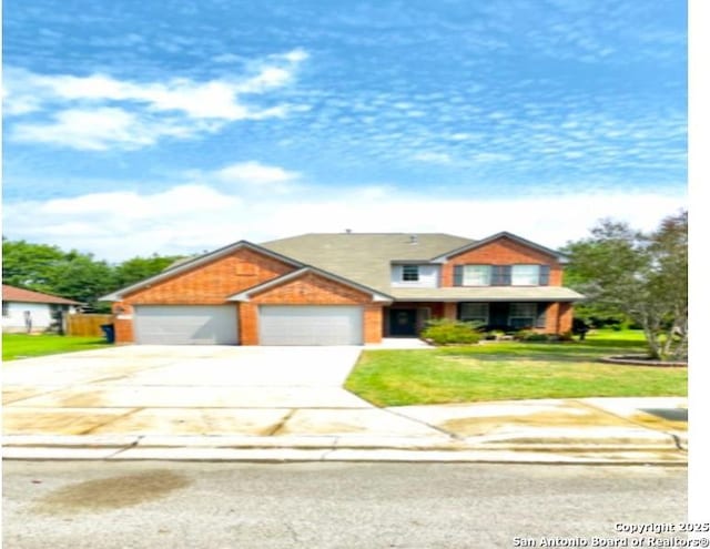 534 Walnut Hts, New Braunfels, TX 78130 - view of front facade featuring driveway, a front lawn, and an attached garage