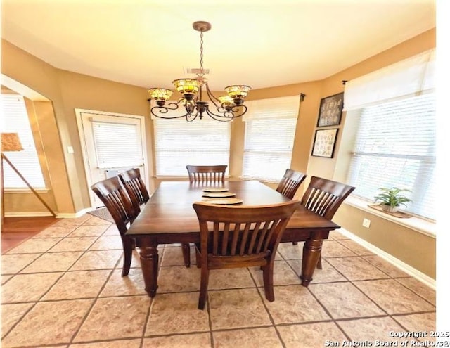 534 Walnut Hts, New Braunfels, TX 78130 - dining space with a chandelier, light tile patterned floors, and baseboards
