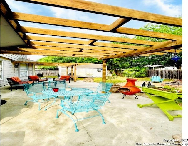 534 Walnut Hts, New Braunfels, TX 78130 - fenced backyard with a pergola, a patio, and outdoor dining space